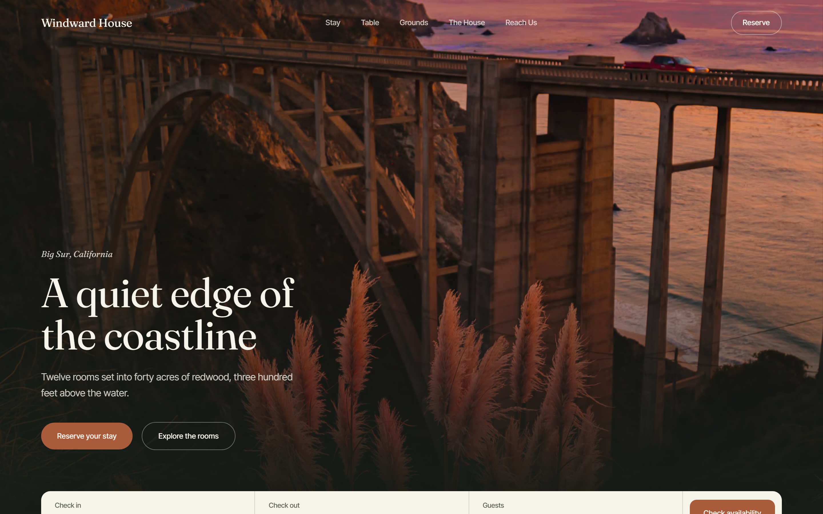 Windward House home page on desktop: a sunset photo of a coastal bridge behind the headline “A quiet edge of the coastline”, with “Reserve your stay” and an availability bar below.